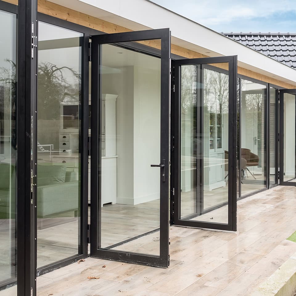 Modern steel hinged doors with large glass panels, perfect for creating a sleek and open look in the home or office.