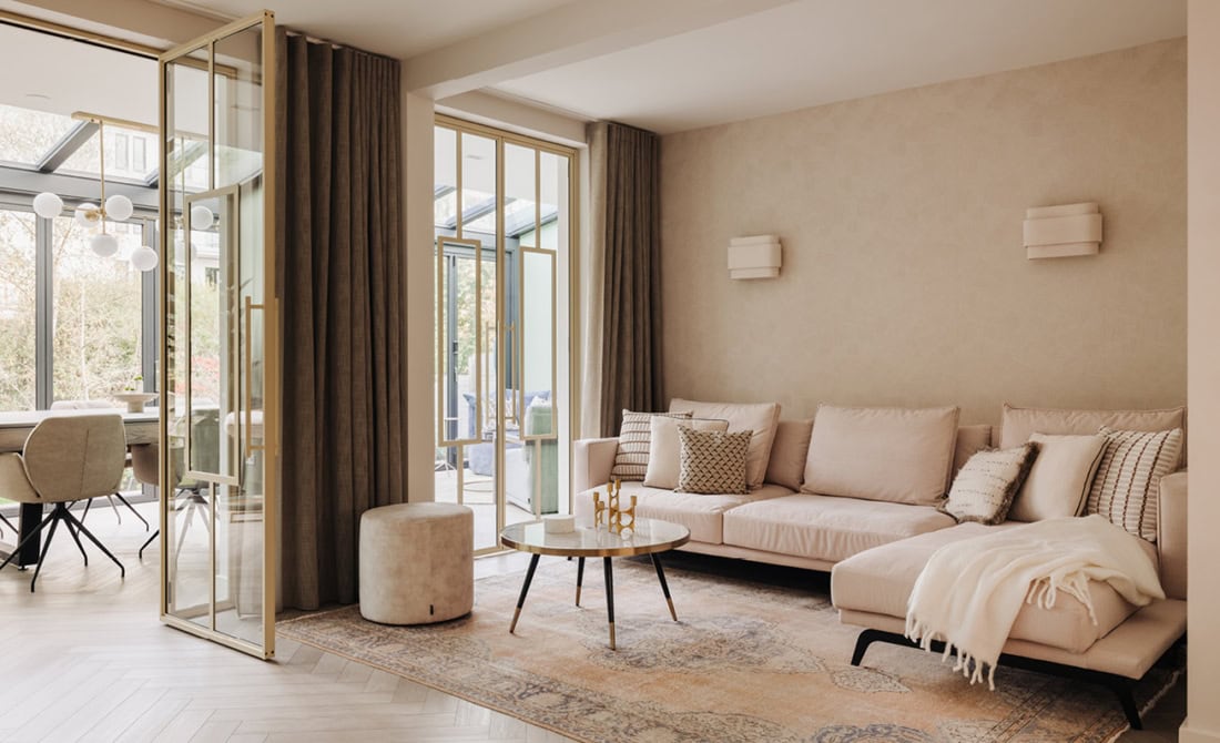 gouden aluminium taatsdeuren woonkamer serre