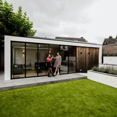 Modern steel garden doors with large glass panels and wooden accents for a sleek and natural look.