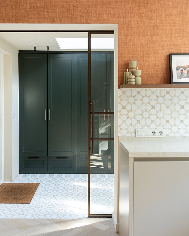 Exchange-tight steel double door with glass filling, custom-made for modern interiors, painted in black-green, complete with black handles.