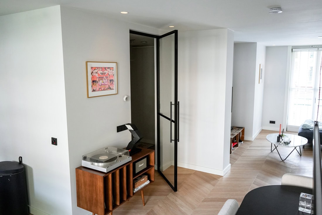 Modern steel patio doors with black frame in a house.