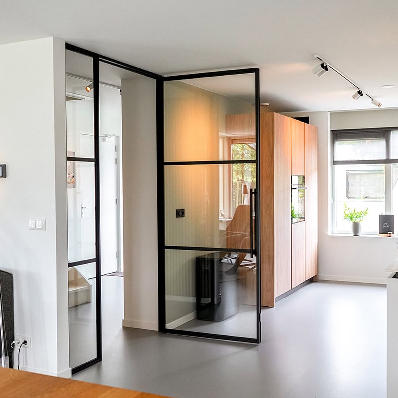 Steel hinged door with frame in hallway of Aluwdoors