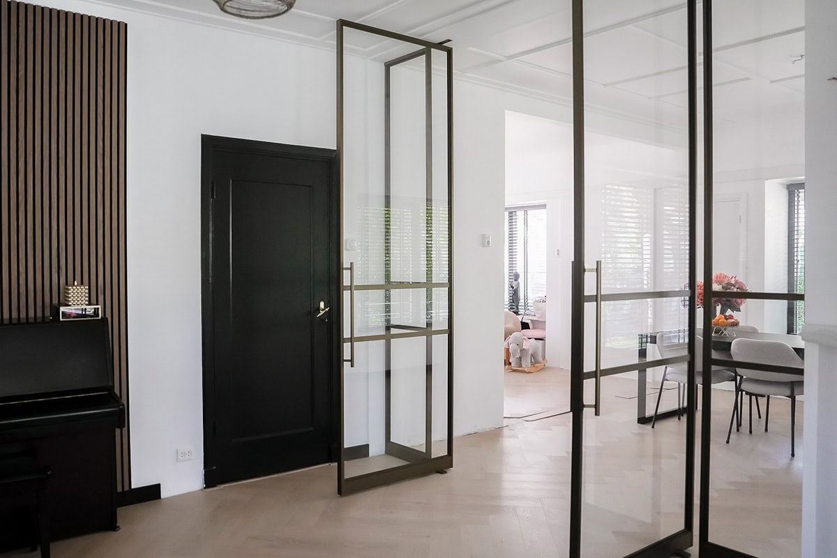 Sleek bespoke steel partitions and doors in modern interiors.