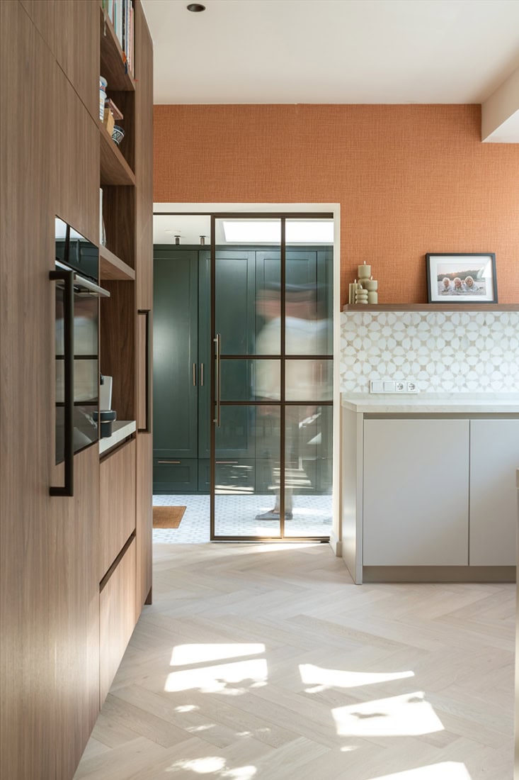 Elegant steel sliding door with black metal frame in modern interior.