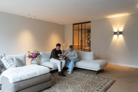 Sleek white industrial steel door with stained-glass panels and black frame, suitable for modern partitions.