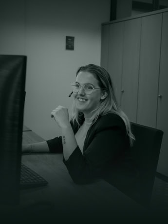 Ge automation, woman at work with computer in office.