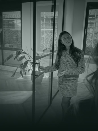 Modern steel dividing door with glass panels for a sleek and stylish look.