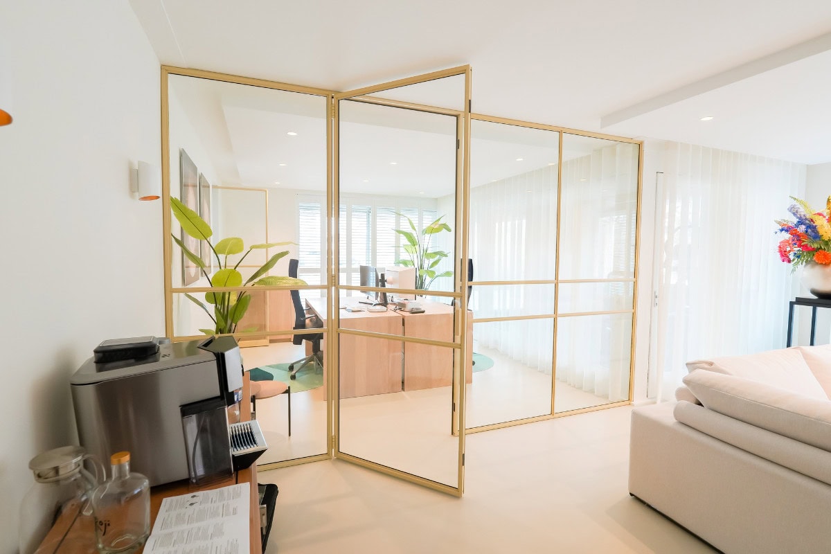 A hinged door with 3 side panels closing the office.