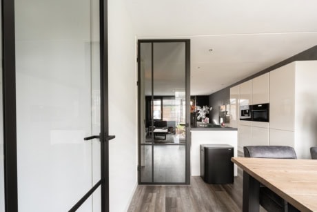 Modern steel garden door with black frame, suitable for indoor and outdoor use, custom-made by Aluwdoors.