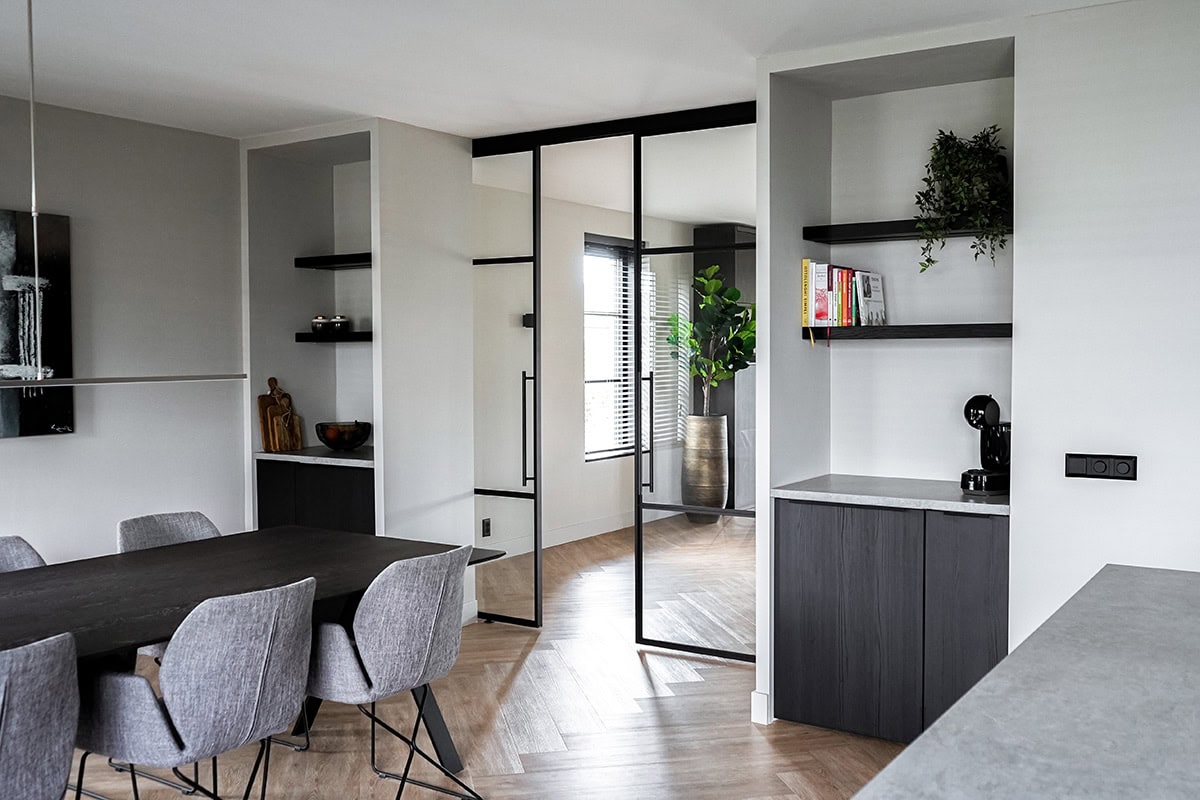 High-quality steel partition with black metal profile in a modern interior.