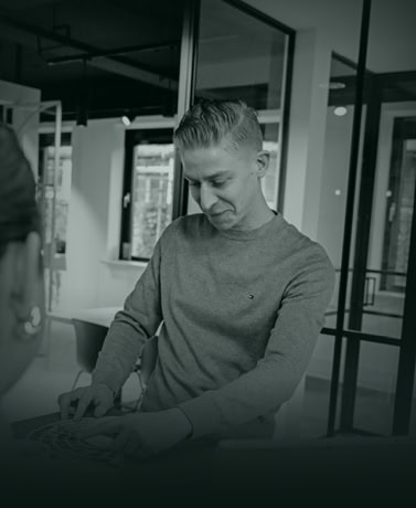 Modern steel door in a sleek, bright interior with large windows for an industrial and contemporary design.