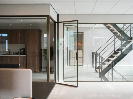 High-quality customised steel door and wall in a modern interior.